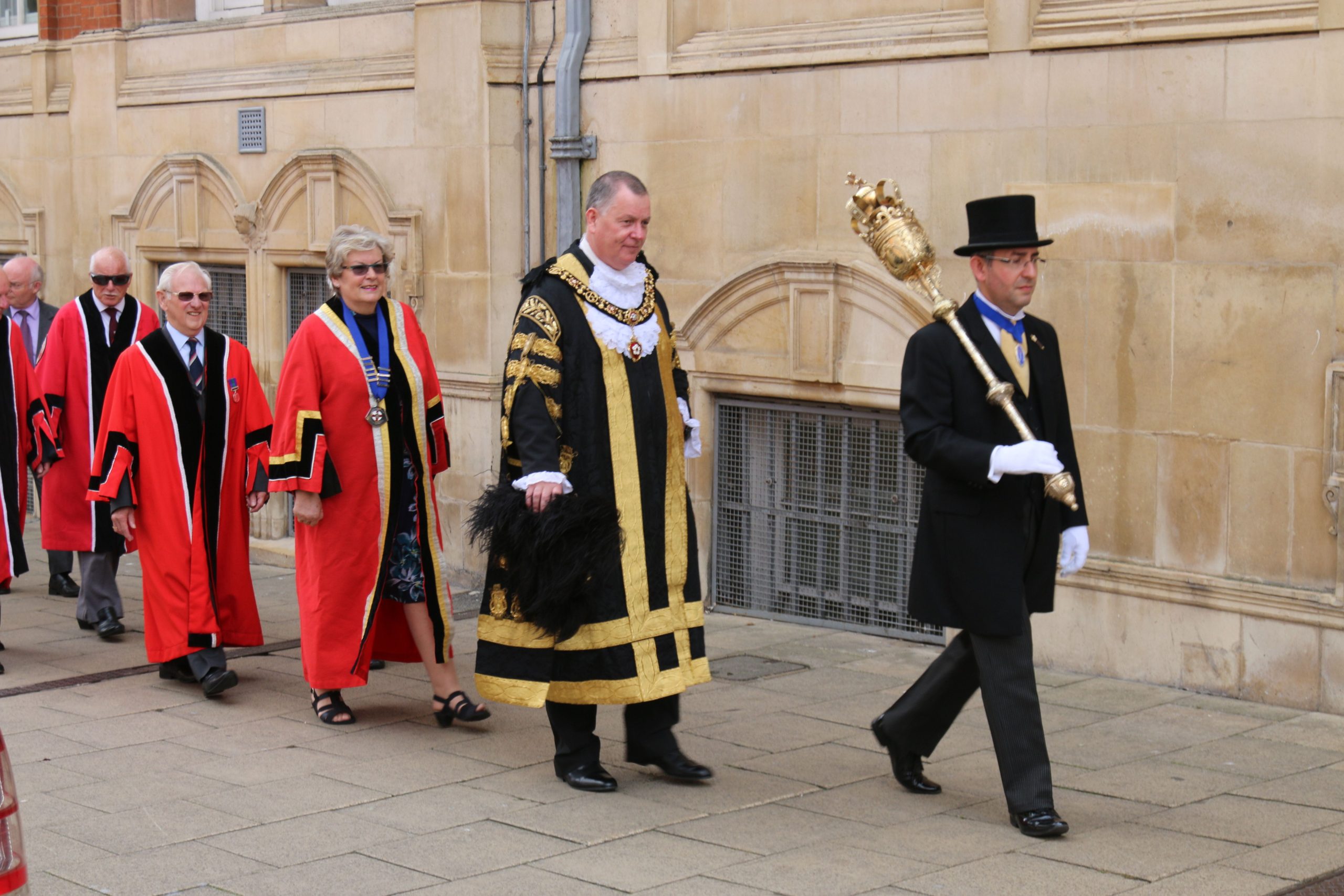 Macebearer and Civic Officer Peter Legg leads the Lord Mayor of the City of Leicester in a procession from the Town Hall